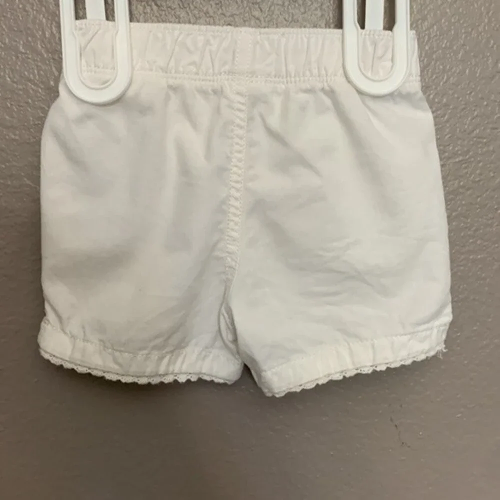 Carter's 12 month baby girl set of top and shorts.